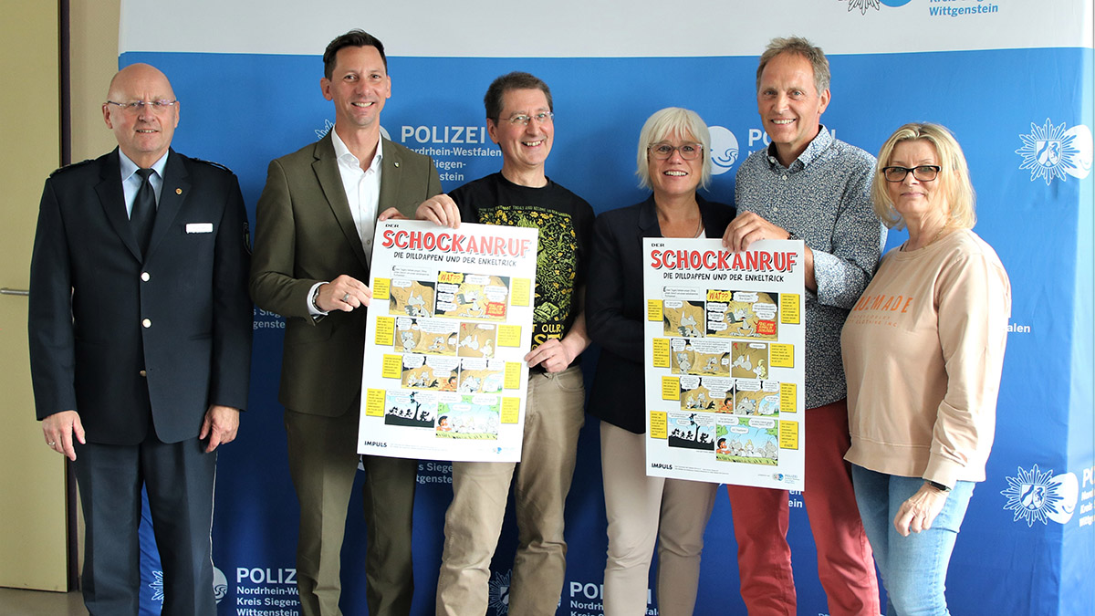 Matthias Kringe (3.v.l.) stellte gemeinsam mit Landrat Andreas Müller (2.v.l.) und Vertretern der Kreispolizeibehörde sowie Silke Menn-Quast vom IMPULS e.V. das Dilldappen-Poster zur Kriminalitätsprävention vor. 